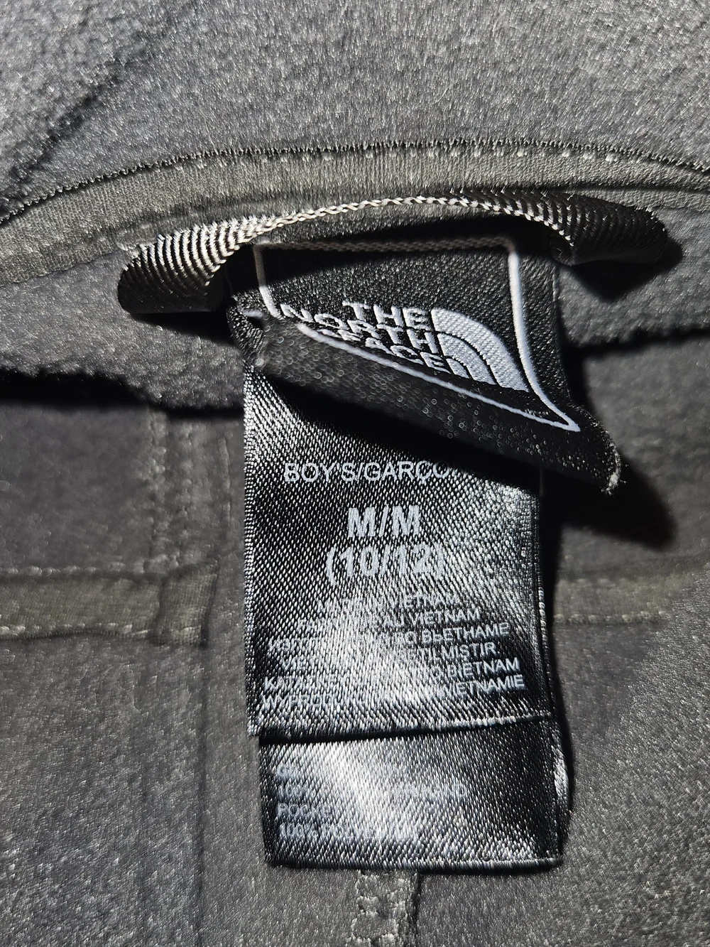 The North Face Kids Dark Gray Fleece Jacket.